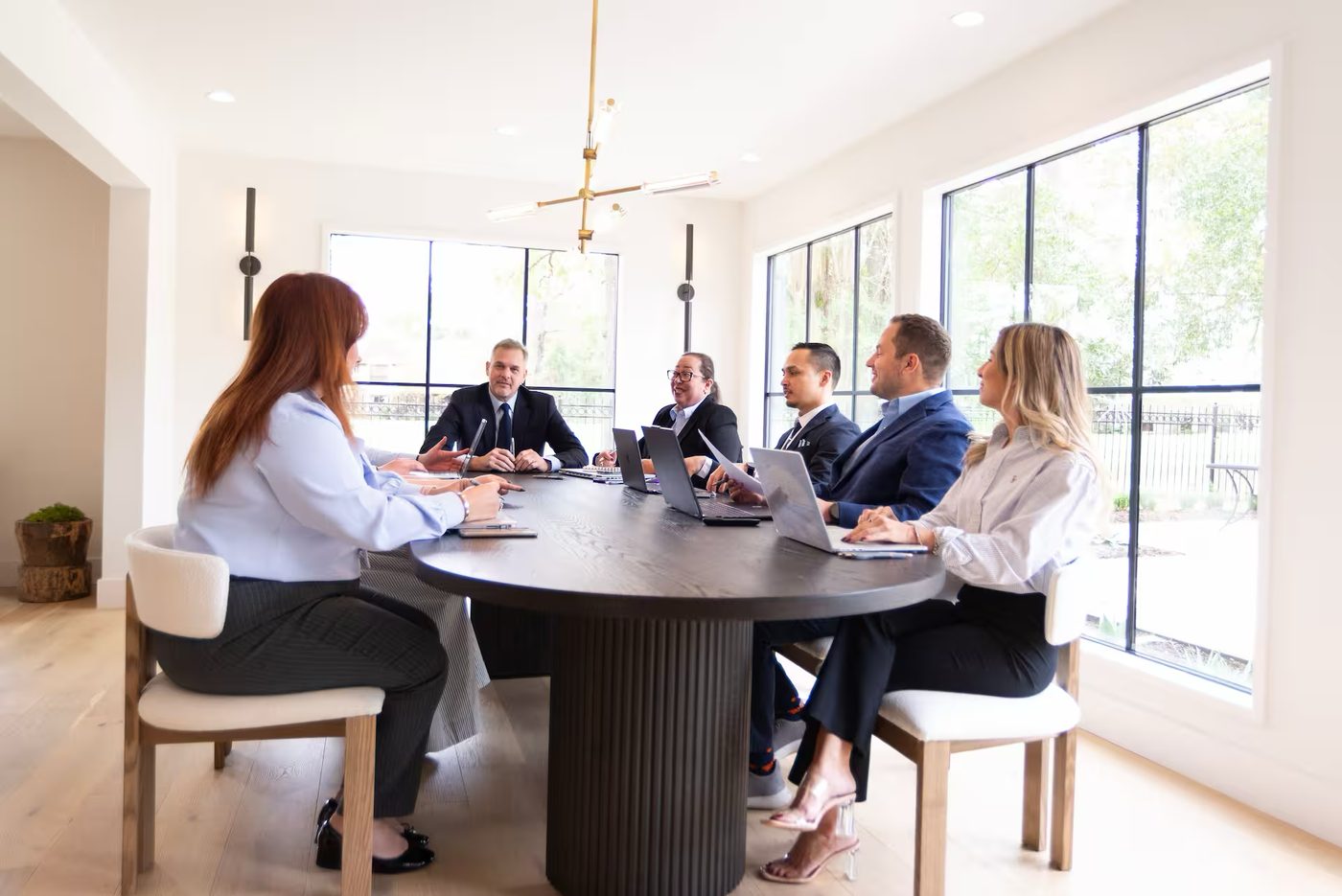 The AlianzEscrow team in a client meeting